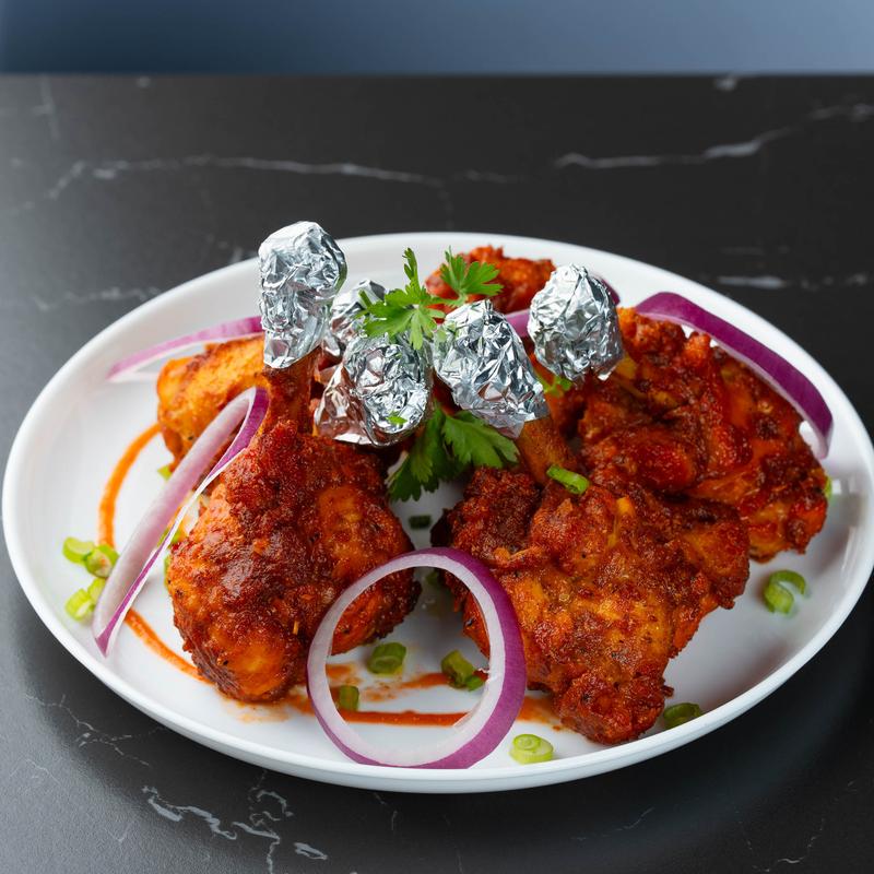 Marinated chicken lollipops.