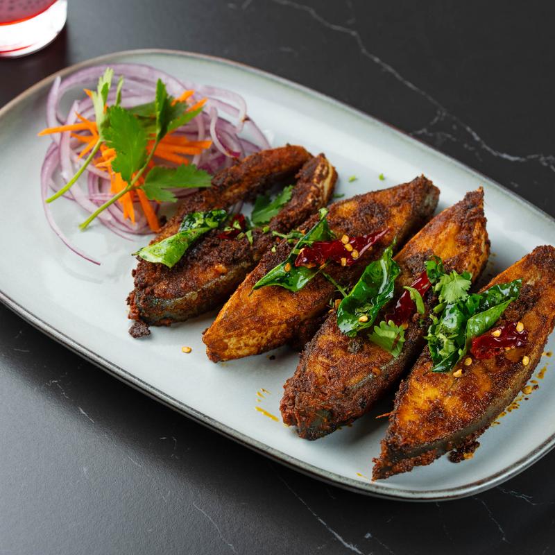 Marinated fish, with herbs and veggies.