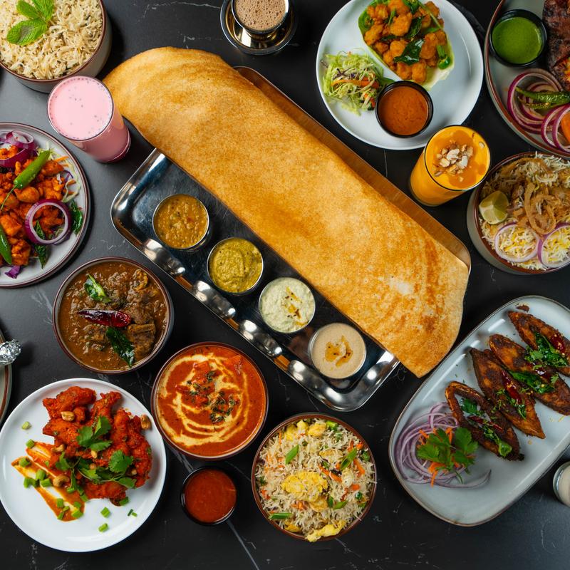 Various food and drinks on the table.