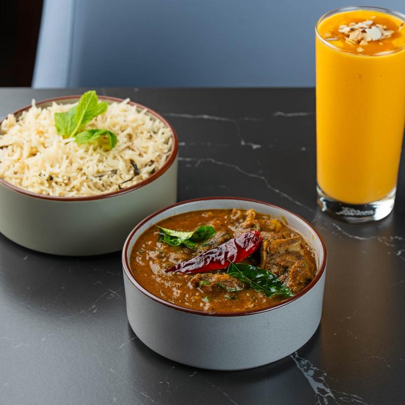 Goat curry, rice, and Mango Lassi.